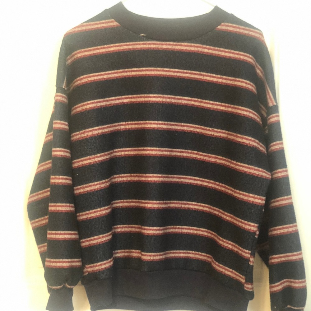 dark blue sweater with yellow and red stripes